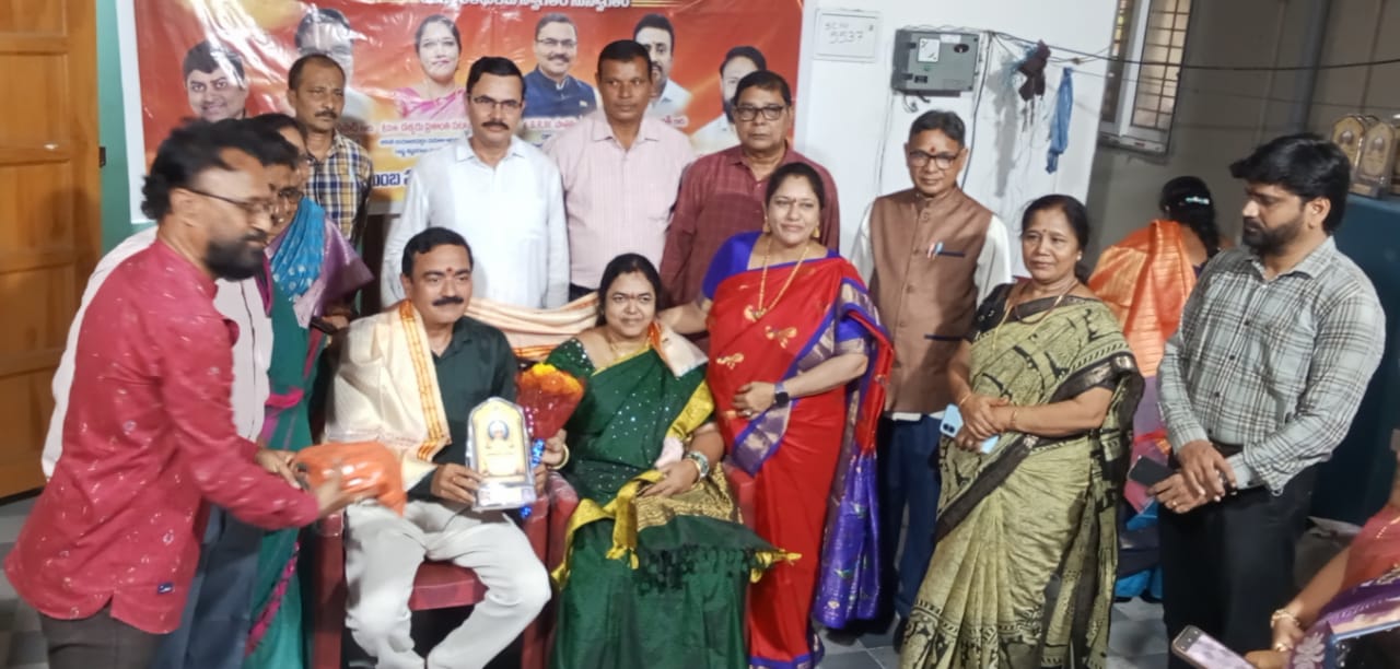 Guru Pooja Utsavam â€” Group photo with banner
